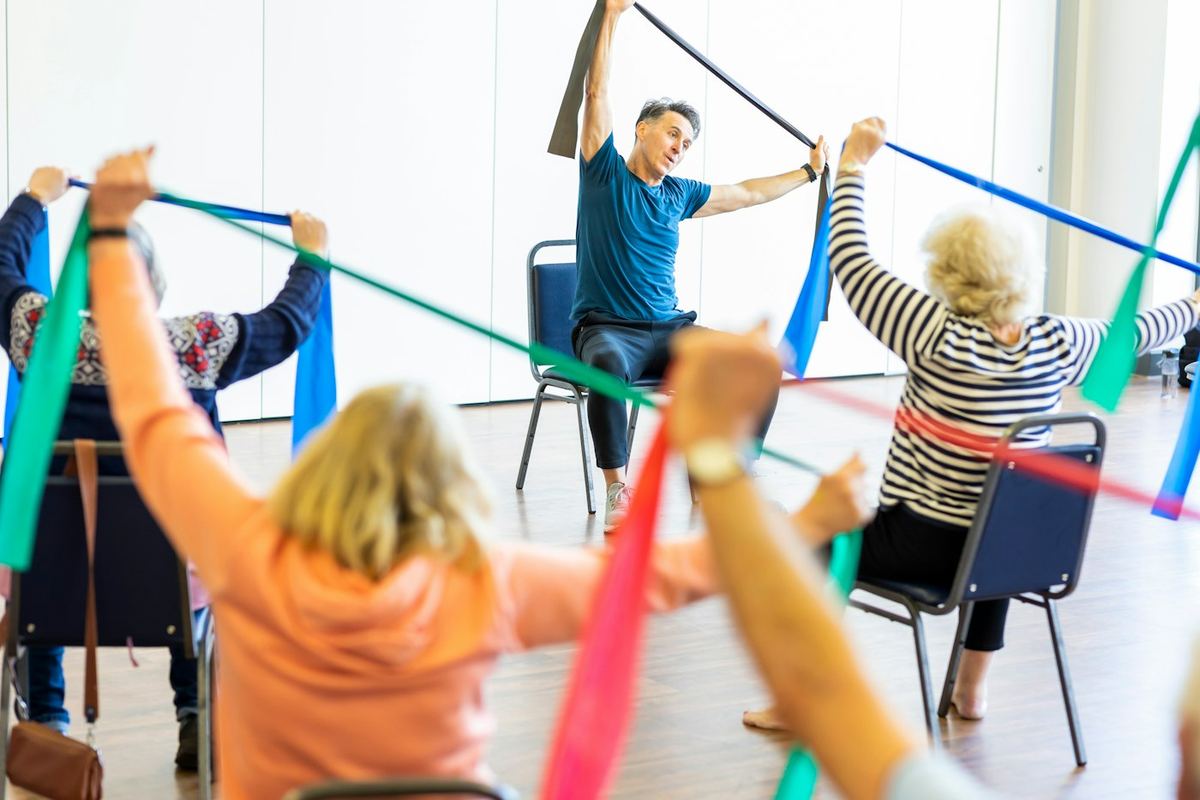 A group of older adults exercising together